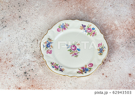 Antique porcelain dish on concrete 62943503