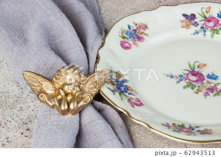 Antique porcelain dish on concrete 62943513