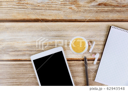 A white note book with cup of coffee digital A white note book with cup of coffee digital 62943548