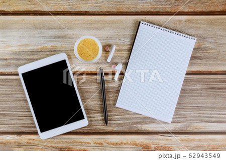 Blank spiral notebook and digital tablet, pencil Blank spiral notebook and digital tablet, pencil 62943549