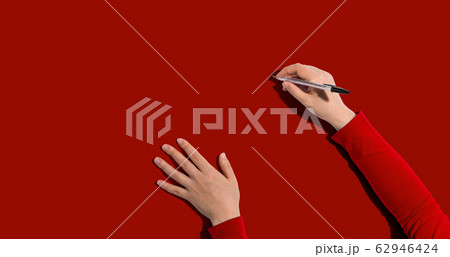 Person writing something with a pen Person writing something with a pen 62946424