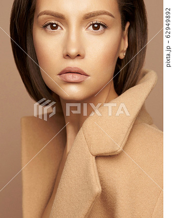 Fashion beautiful lady in beige coat 62949892