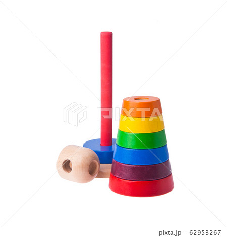 Toy or baby toy wood color pyramid on background 62953267