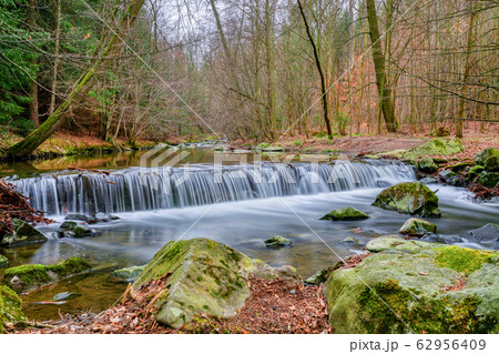 small waterfall in springtime 62956409