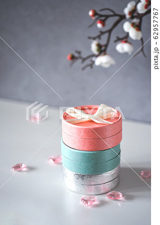 Set of gift boxes in pastel shades with delicate flowers. Female greeting card concept. Present for Mom's Day and International Women's Day Set of gift boxes in pastel shades with delicate flowers. Female greeting card concept. Present for Mom's Day and International Women's Day 62957767
