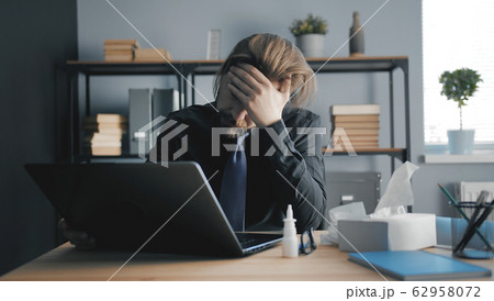 Diseased male suffering headache working Diseased male suffering headache working 62958072