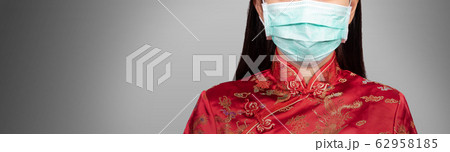 Asian woman in Chinese costume wear a hygienic mask with copy space, anonymous face. the outbreak situation of Coronavirus 2019 infection or Covid-19 concept Asian woman in Chinese costume wear a hygienic mask with copy space, anonymous face. the outbreak situation of Coronavirus 2019 infection or Covid-19 concept 62958185