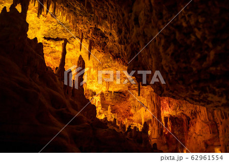 Formations of stalactites and stalagmites in a cave. Mallorca, Spain 62961554