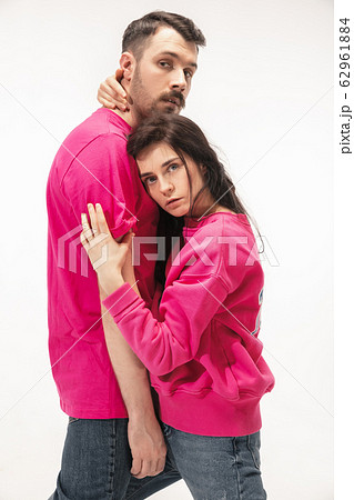 Trendy fashionable couple isolated on white studio background Trendy fashionable couple isolated on white studio background 62961884