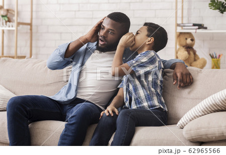 Black Son Sharing Secret With Dad, Whispering To His Ear Black Son Sharing Secret With Dad, Whispering To His Ear 62965566