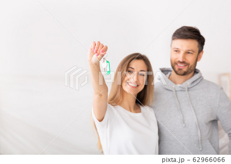 Young smiling couple showing keys of new home 62966066