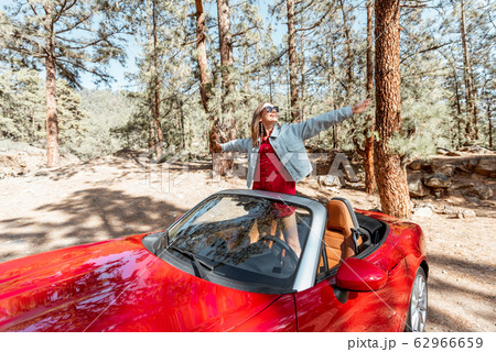 Woman traveling by car on nature 62966659