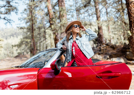 Woman traveling by car on nature Woman traveling by car on nature 62966712