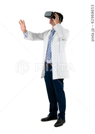 Caucasian businessman wearing a Virtual Reality headset Caucasian businessman wearing a Virtual Reality headset 62968653