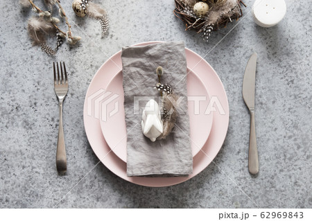 Easter table setting with pink plate, bunny Easter table setting with pink plate, bunny 62969843