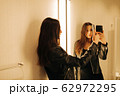 young woman in the fitting room making selfie young woman in the fitting room making selfie 62972295