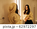 young woman in the fitting room young woman in the fitting room 62972297