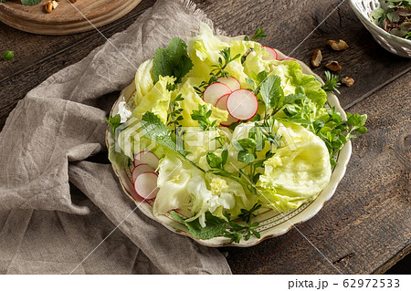 Spring salad with wild edible plants - chickweed, young bedstraw and common nipplewort Spring salad with wild edible plants - chickweed, young bedstraw and common nipplewort 62972533