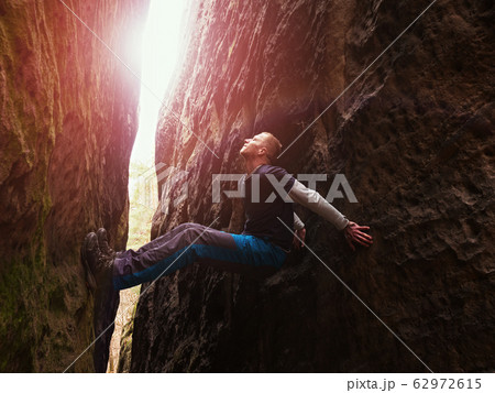 Rock climbing, funny bouldering. Man athlete Rock climbing, funny bouldering. Man athlete 62972615