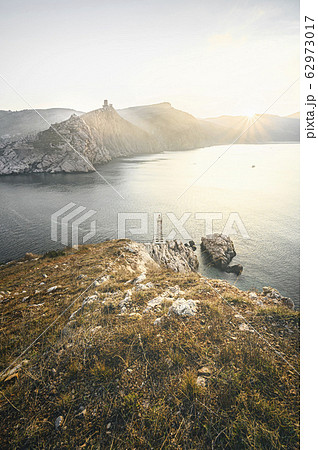 Sunrise at the seaside. View from top of a mountain Sunrise at the seaside. View from top of a mountain 62973017