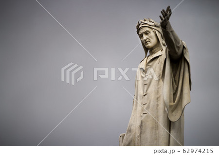 Statue of Dante Alighieri in Naples against the background of gray clouds, close-up, bad weather Statue of Dante Alighieri in Naples against the background of gray clouds, close-up, bad weather 62974215