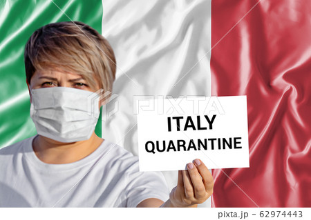 Woman in face mask hold sheet with inscription Woman in face mask hold sheet with inscription 62974443