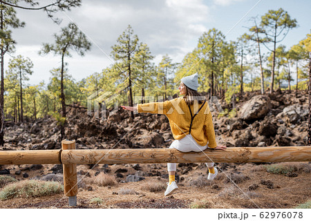 Stylish woman traveling in the forest 62976078