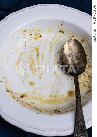 Dirty dishes plates, spoon, fork on the table 62977396
