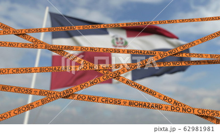 Do not cross biohazard tape lines on the Dominican flag background. Restricted entry or quarantine in the Dominican Republic. Conceptual 3D rendering Do not cross biohazard tape lines on the Dominican flag background. Restricted entry or quarantine in the Dominican Republic. Conceptual 3D rendering 62981981
