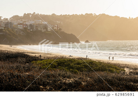 Windy day on Baker Beach near Golden Gate bridge. 62985691