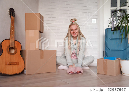 Young woman moved to a new apartment to live separately from her parents. 62987647