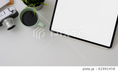 Top view of photographer workspace with blank 62991458