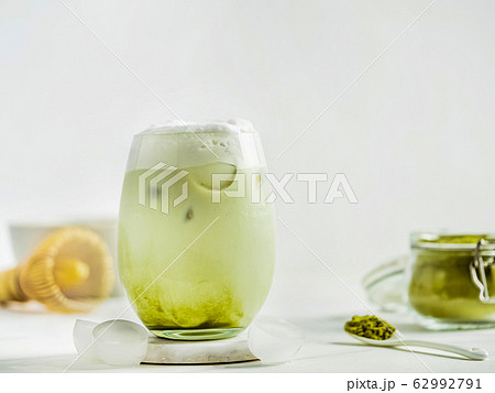 Iced Matcha Latte Tea with whipped cream 62992791