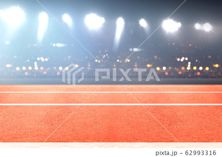 Running track and tribune with blurred lights Running track and tribune with blurred lights 62993316