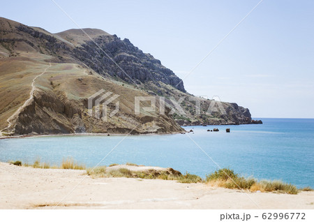 Meganom mountain range and beach, as well as the Meganom mountain range and beach, as well as the 62996772