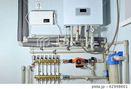 Pump with a thermometer for a water underfloor heating system at home Pump with a thermometer for a water underfloor heating system at home 62998601