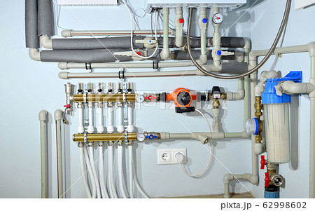 Pump with a thermometer for a water underfloor heating system at home Pump with a thermometer for a water underfloor heating system at home 62998602