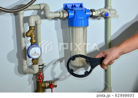 Mounting of house rainwater filter system. Borehole drilling and water treatment Mounting of house rainwater filter system. Borehole drilling and water treatment 62998605