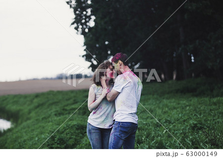 Happy couple celebrating holi festival 63000149