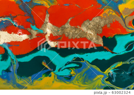 Mixed colorful inks background with golden glitter. Abstract paint texture. Mixed colorful inks background with golden glitter. Abstract paint texture. 63002324