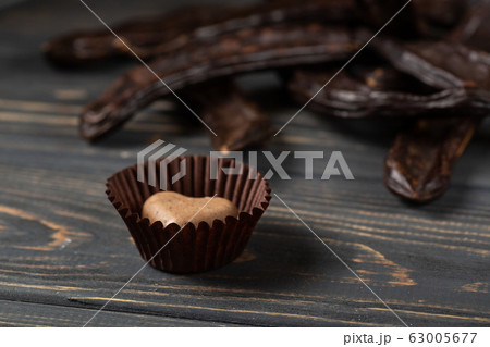 Healthy raw vegan sweet homemade candy on a wooden Healthy raw vegan sweet homemade candy on a wooden 63005677