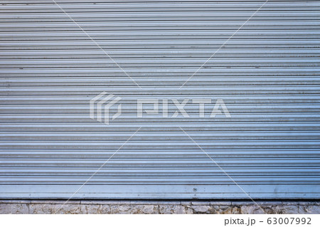 rusty old blue shutter metal door  background with 63007992