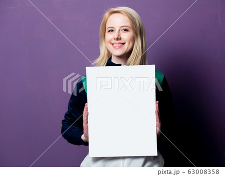Style blonde woman in 80s clothes with white 63008358