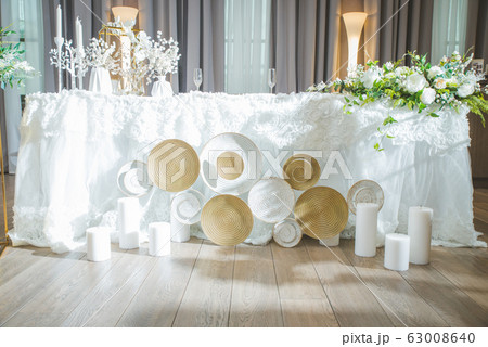 A very nicely decorated wedding table with plates A very nicely decorated wedding table with plates 63008640