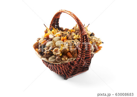 Large wicker basket full of nuts Large wicker basket full of nuts 63008683