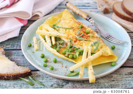 Green peas omelet with hard cheese and rye bread 63008761
