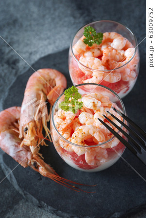 Two verrines for appetizer. Shrimps with grapefruit and cream 63009752