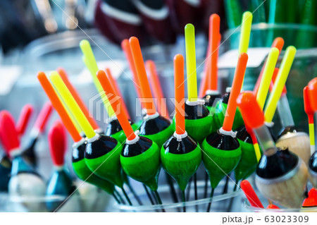 different fishing floats on the window of a fishing store 63023309
