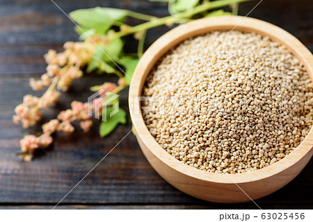 Organic raw brown quinoa seed in a bowl, healthy food 63025456