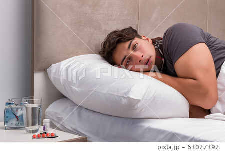 Sick man resting in the bed 63027392